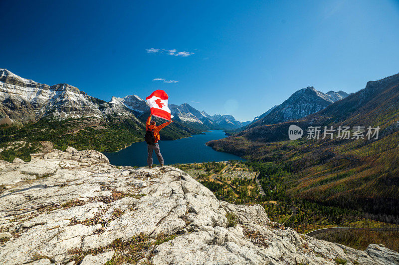 Waterton Lakes National Park and man with Canada flag